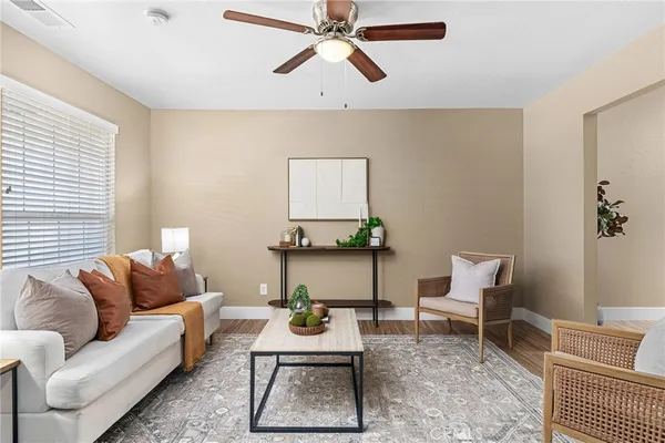 a living room with furniture and a rug