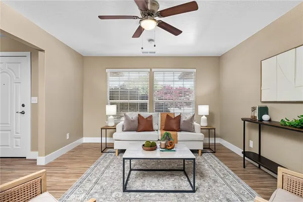 a living room with furniture and a window