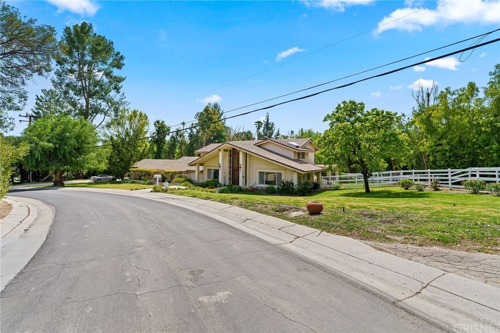 24862 Eldorado Meadow Road Hidden Hills, CA 91302 - Photo 3 of 16 a front view of a house with a yard