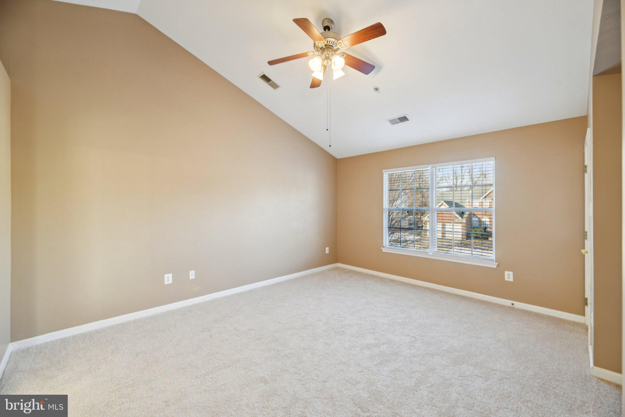 14505 Pleffner Court Bowie, MD 20720 - Photo 13 of 41 an empty room with a window and a ceiling fan