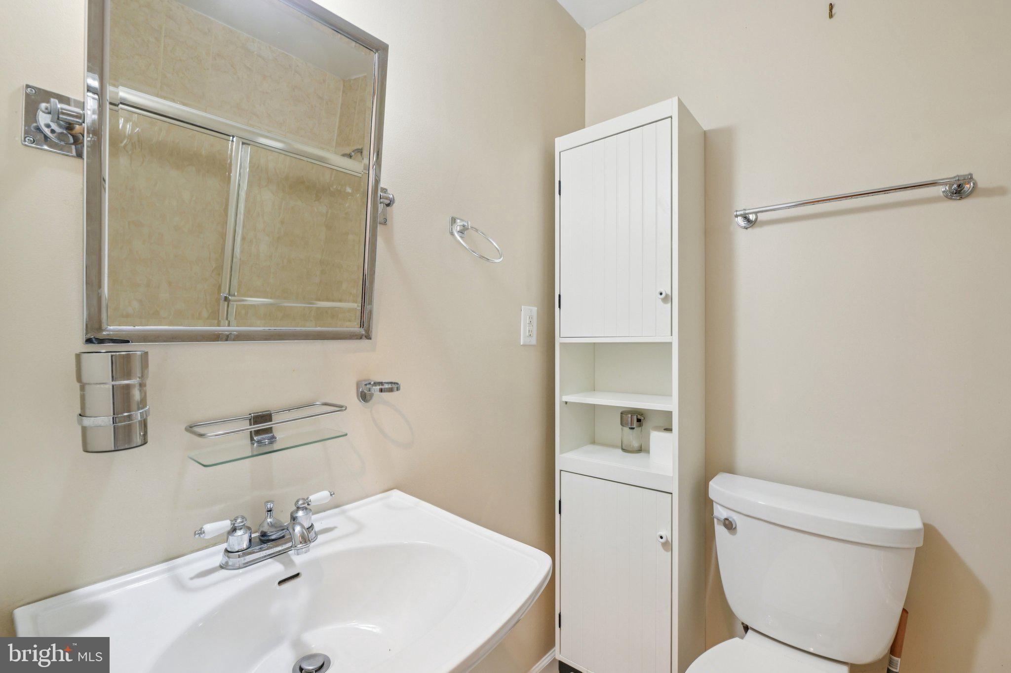 14505 Pleffner Court Bowie, MD 20720 - Photo 26 of 41 a bathroom with a sink a toilet and shower