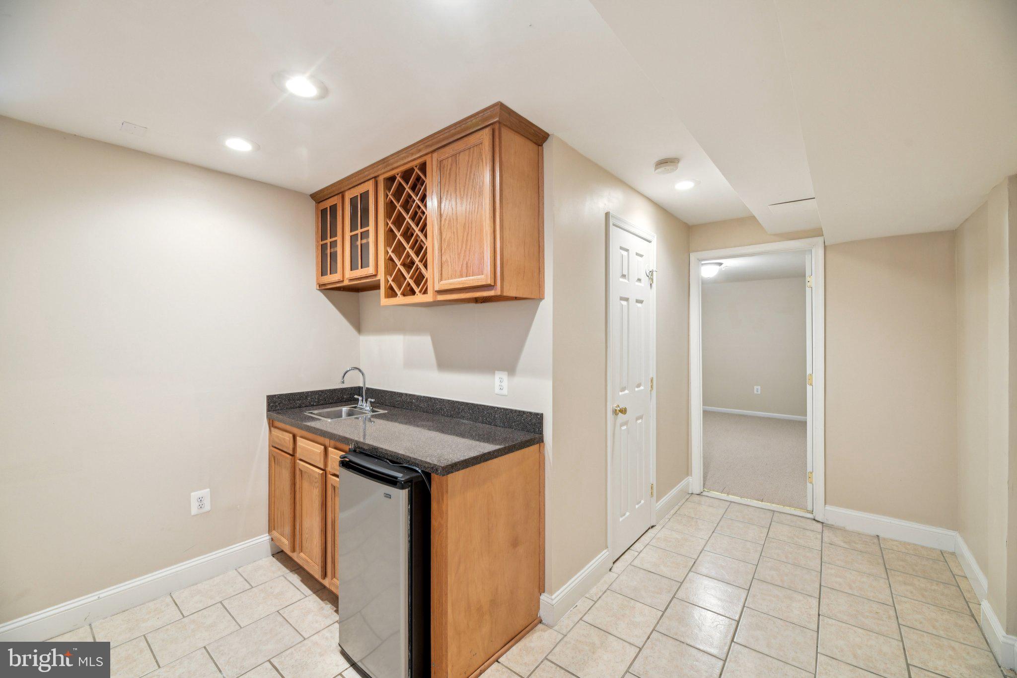 14505 Pleffner Court Bowie, MD 20720 - Photo 36 of 41 a utility room with a sink a vanity and a window