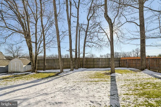 a view of a house with swimming pool and sitting area