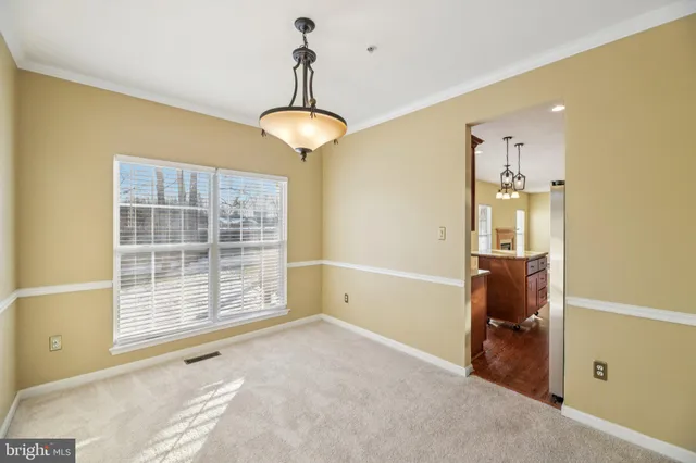 a view of a room with cabinet wooden floor and windows