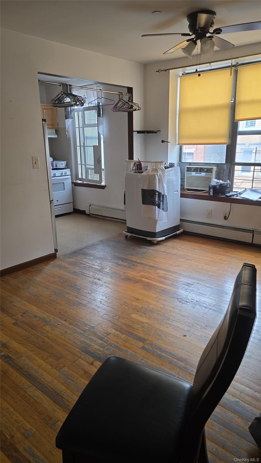 a view of a kitchen with furniture and a window