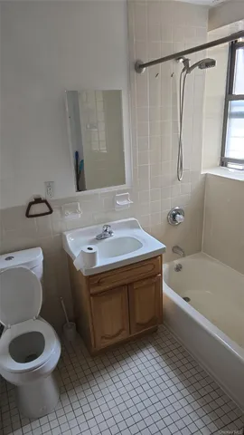 a bathroom with a sink a toilet and a bathtub