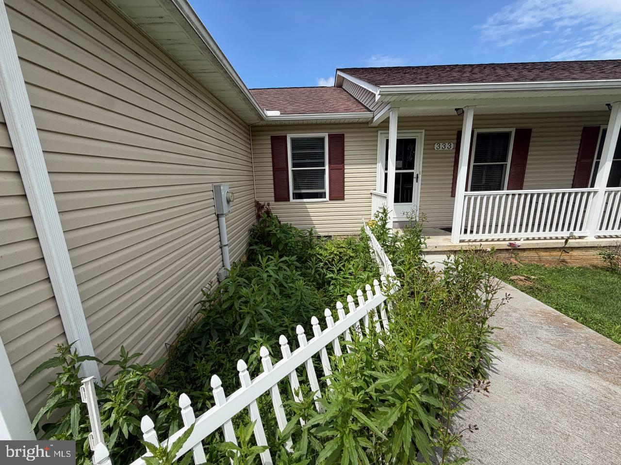 333 East Bailey Road Lewisburg, WV 24901 - Photo 6 of 57 Charming home with lush greenery.