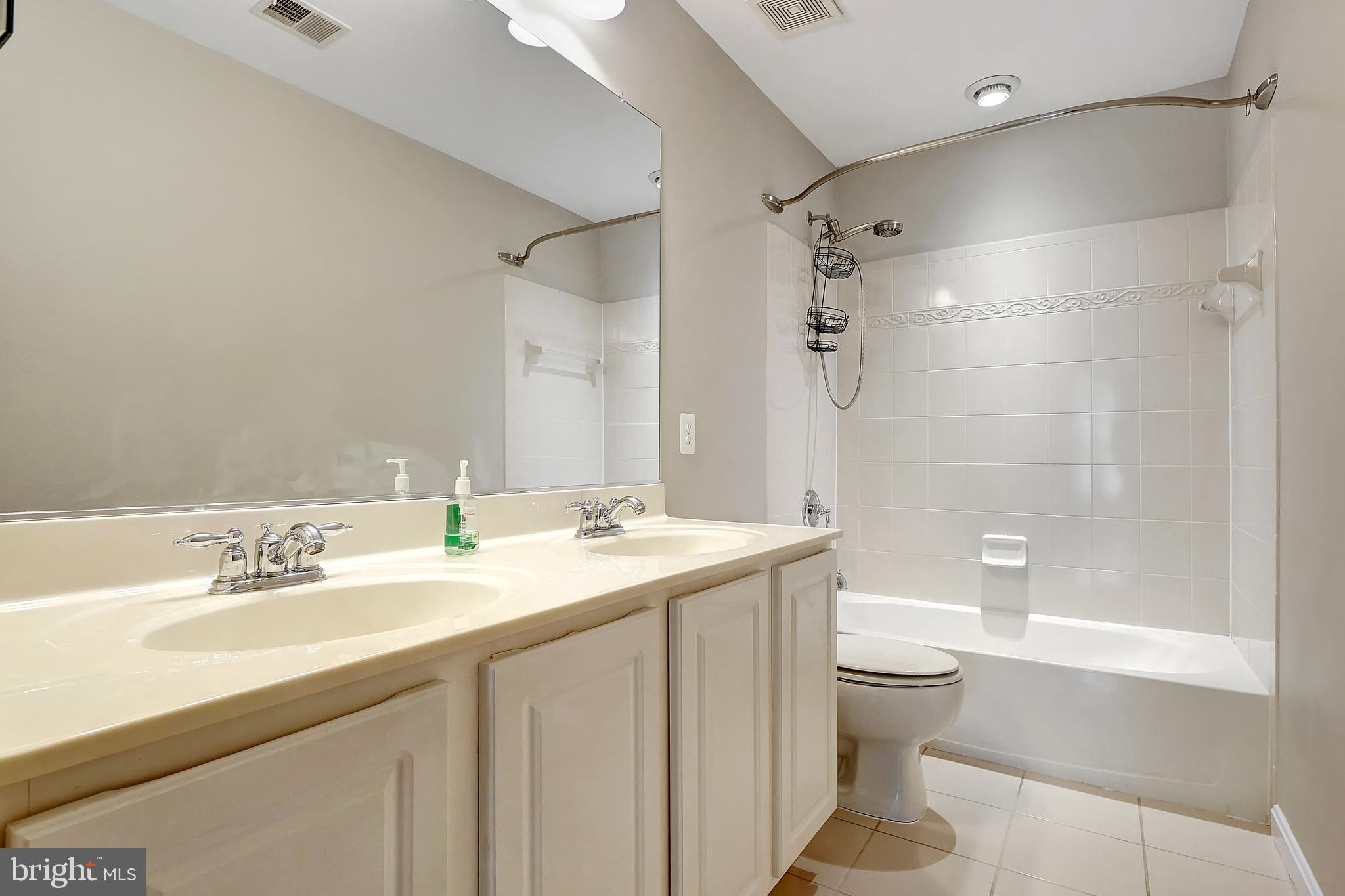 2683 Cast Off Loop Woodbridge, VA 22191 - Photo 32 of 46 Hall Full Bathroom with dual vanity and tub