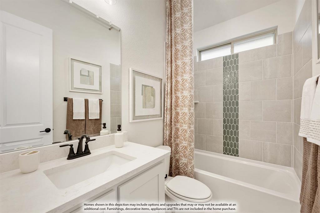 1145 Hitching Post Way Oak Point, TX 75068 - Photo 11 of 36 a bathroom with a granite countertop sink a toilet and shower