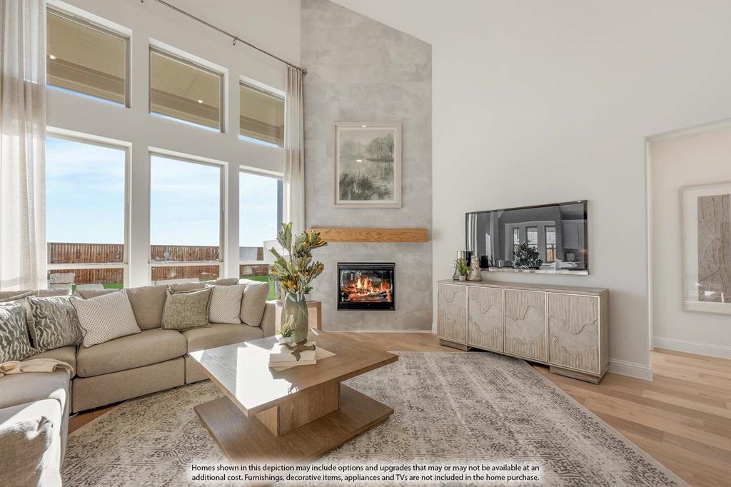 1145 Hitching Post Way Oak Point, TX 75068 - Photo 12 of 36 a living room with furniture and a fireplace