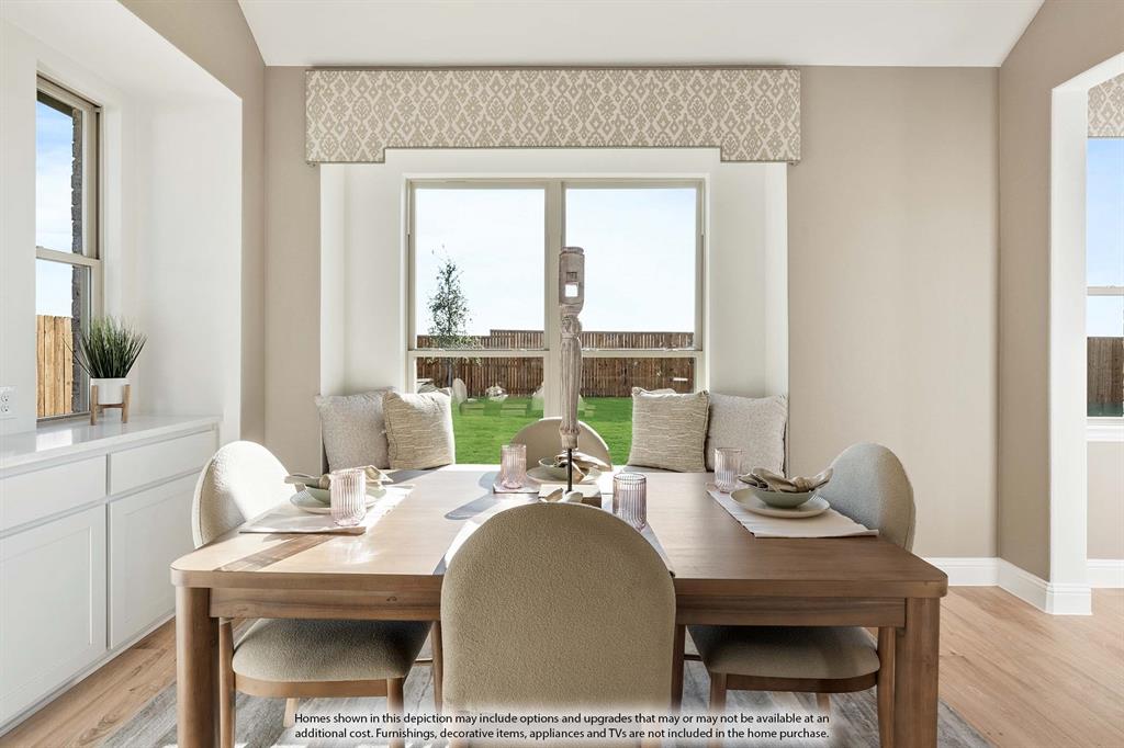 1145 Hitching Post Way Oak Point, TX 75068 - Photo 22 of 36 a view of a dining room with furniture window and outside view