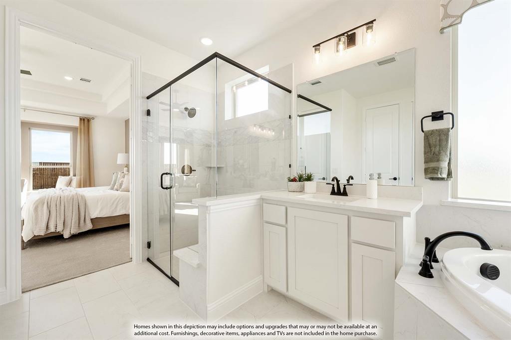 1145 Hitching Post Way Oak Point, TX 75068 - Photo 28 of 36 a bathroom with a sink a mirror and a bathtub