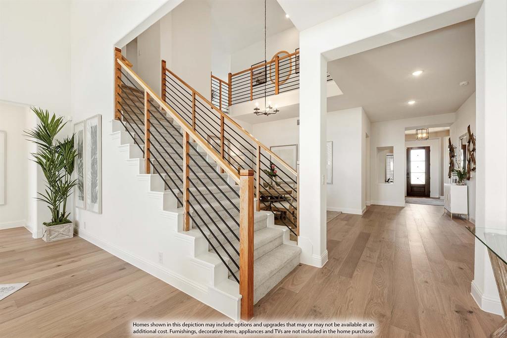 1145 Hitching Post Way Oak Point, TX 75068 - Photo 29 of 36 a view of a hallway with wooden floor and stairs