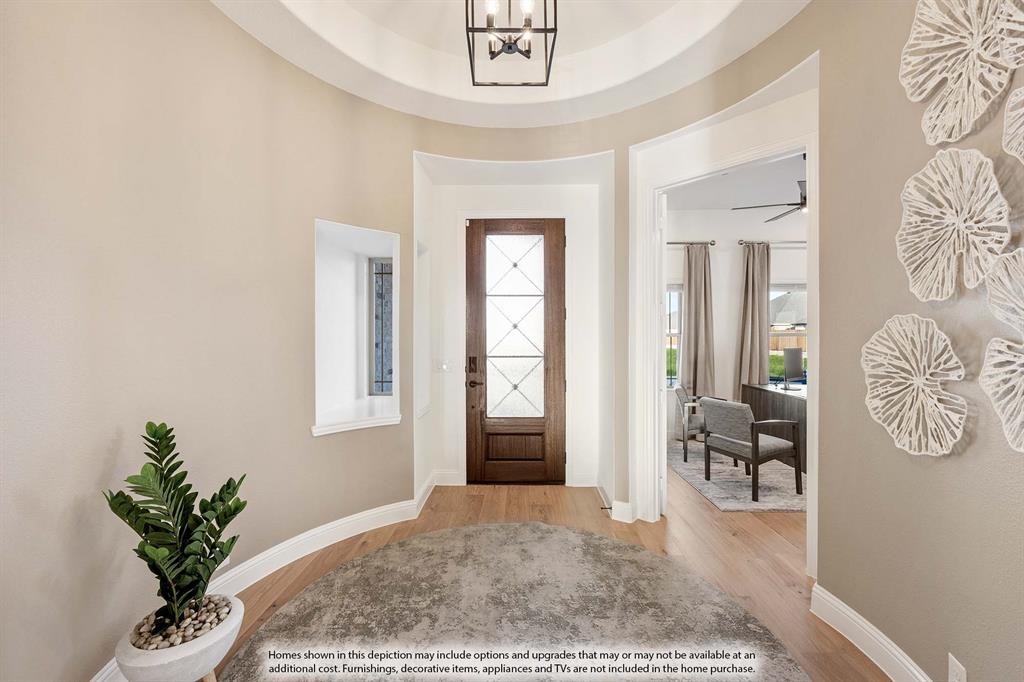 1145 Hitching Post Way Oak Point, TX 75068 - Photo 3 of 36 a living room with furniture and a potted plant