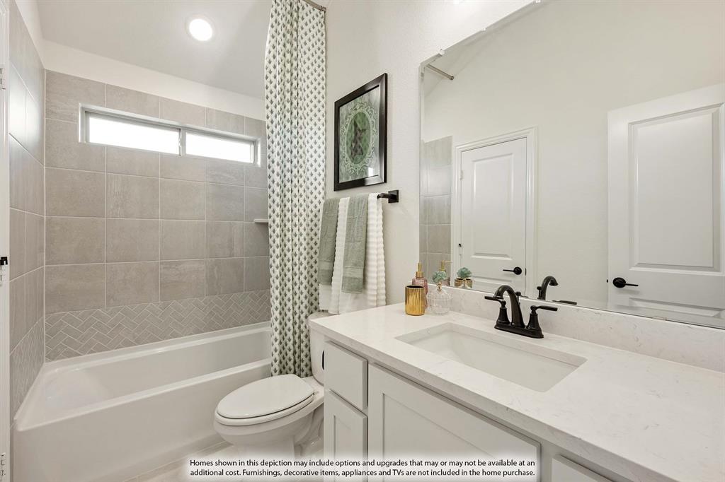 1145 Hitching Post Way Oak Point, TX 75068 - Photo 32 of 36 a bathroom with a sink a toilet and a bathtub