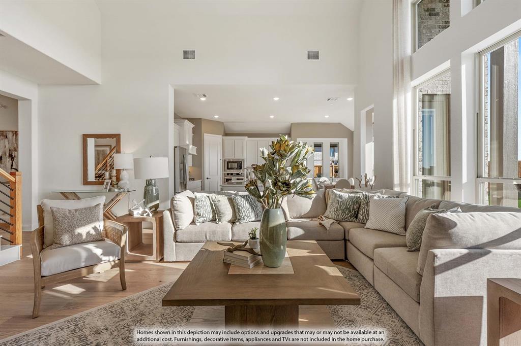 1145 Hitching Post Way Oak Point, TX 75068 - Photo 4 of 36 a living room with furniture potted plant and a large window