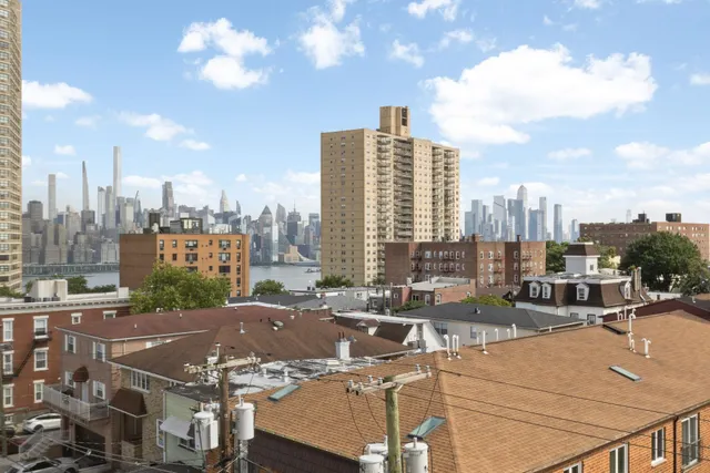 a terrace with a bench and lake view