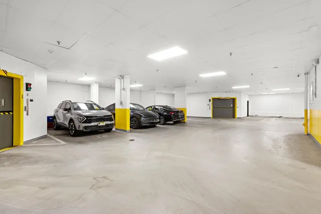 a view of swimming pool with outdoor seating and city view