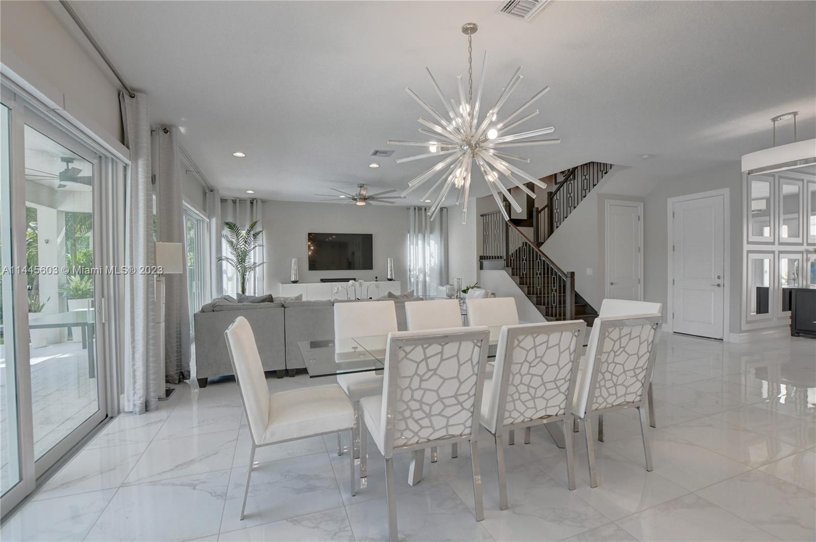 11655 Windy Frst Way Boca Raton, FL 33498 - Photo 15 of 69 a living room with furniture a fireplace and a flat screen tv