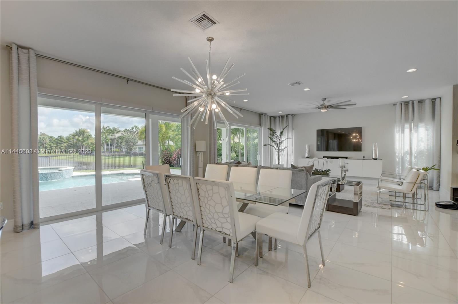11655 Windy Frst Way Boca Raton, FL 33498 - Photo 18 of 69 a view of a dining room with furniture window and outside view