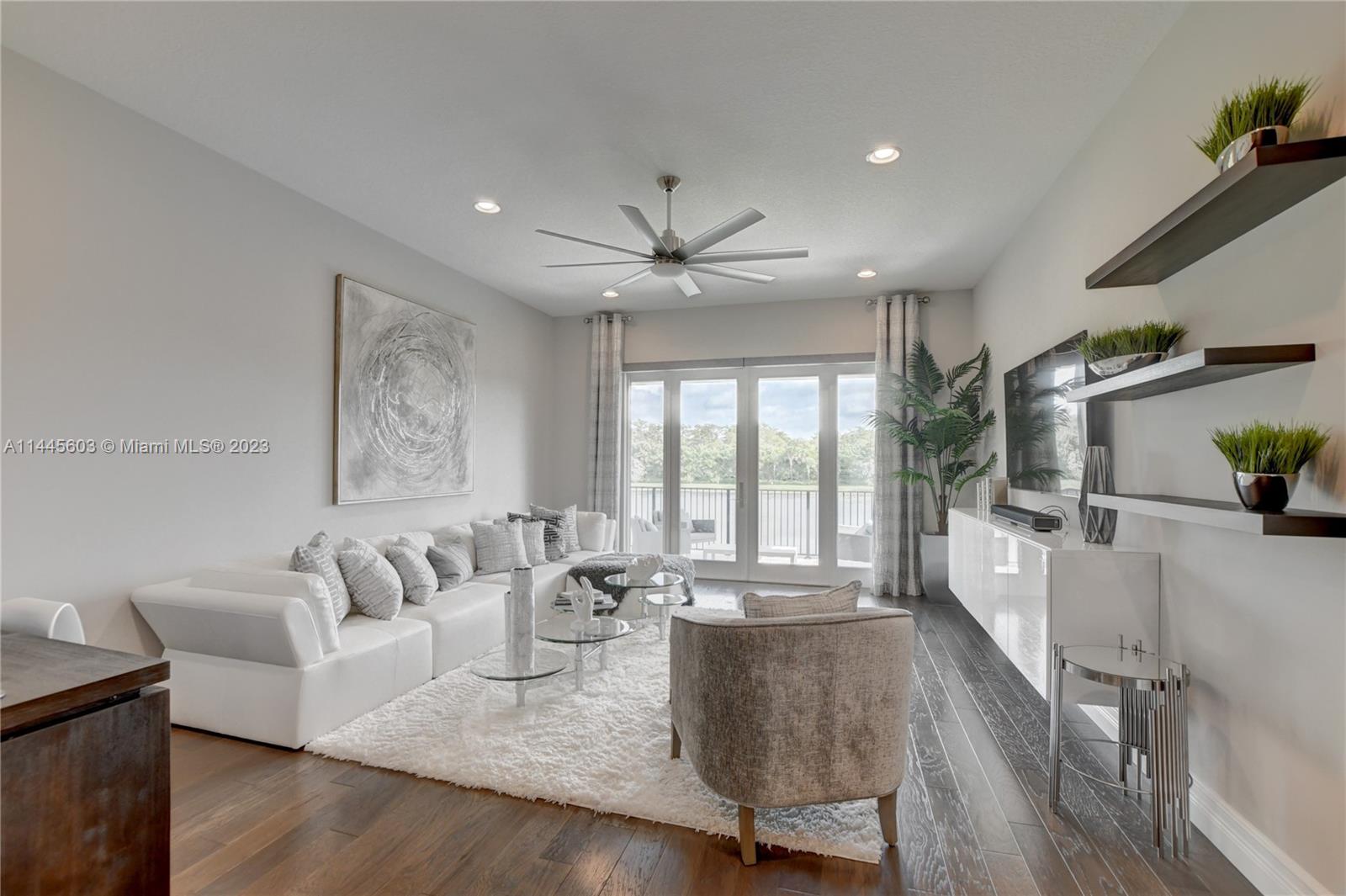 11655 Windy Frst Way Boca Raton, FL 33498 - Photo 22 of 69 a living room with furniture and a large window