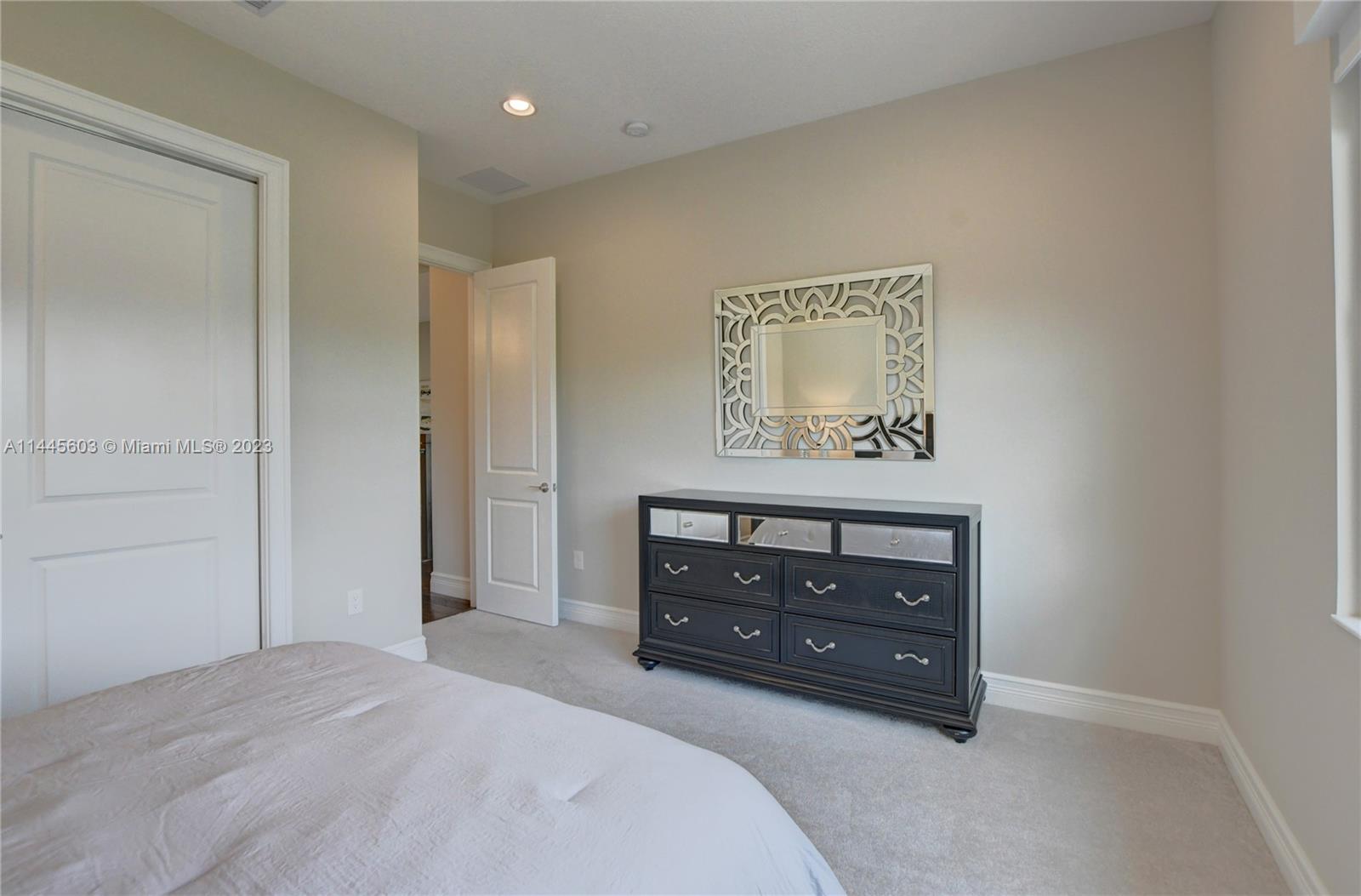 11655 Windy Frst Way Boca Raton, FL 33498 - Photo 30 of 69 a room with a bed and a dresser