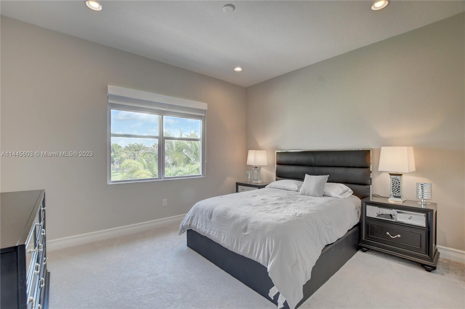 11655 Windy Frst Way Boca Raton, FL 33498 - Photo 31 of 69 a bedroom with a bed and a window