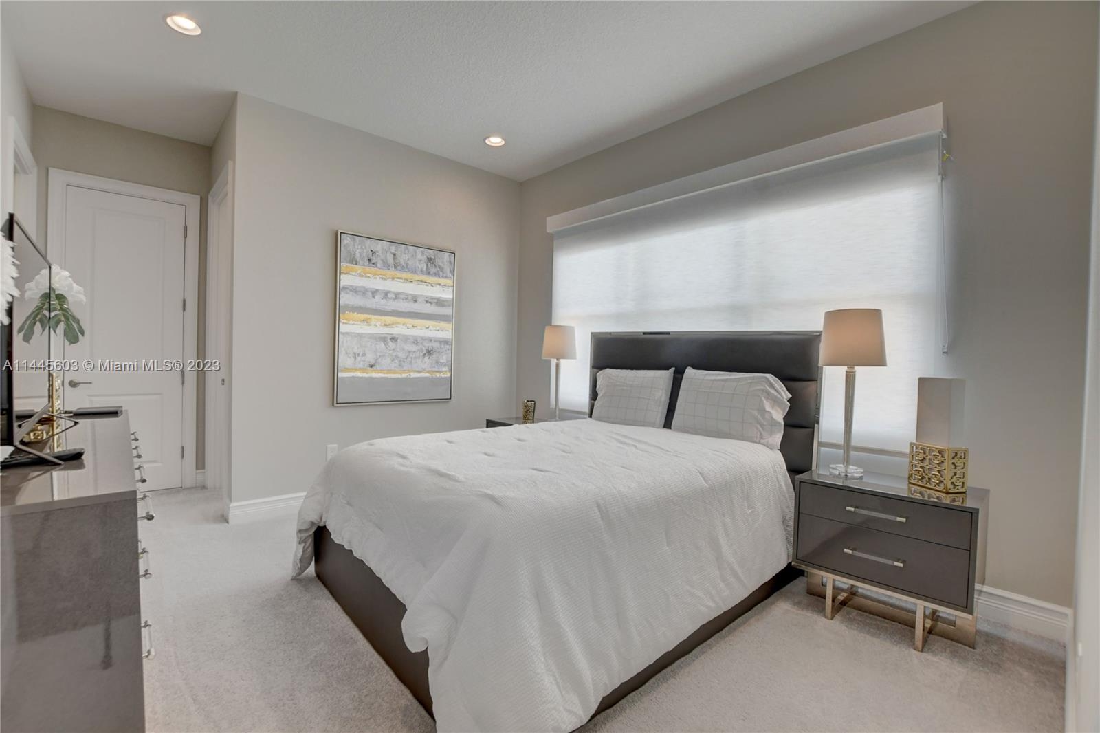 11655 Windy Frst Way Boca Raton, FL 33498 - Photo 33 of 69 a bedroom with a bed and a flat tv screen