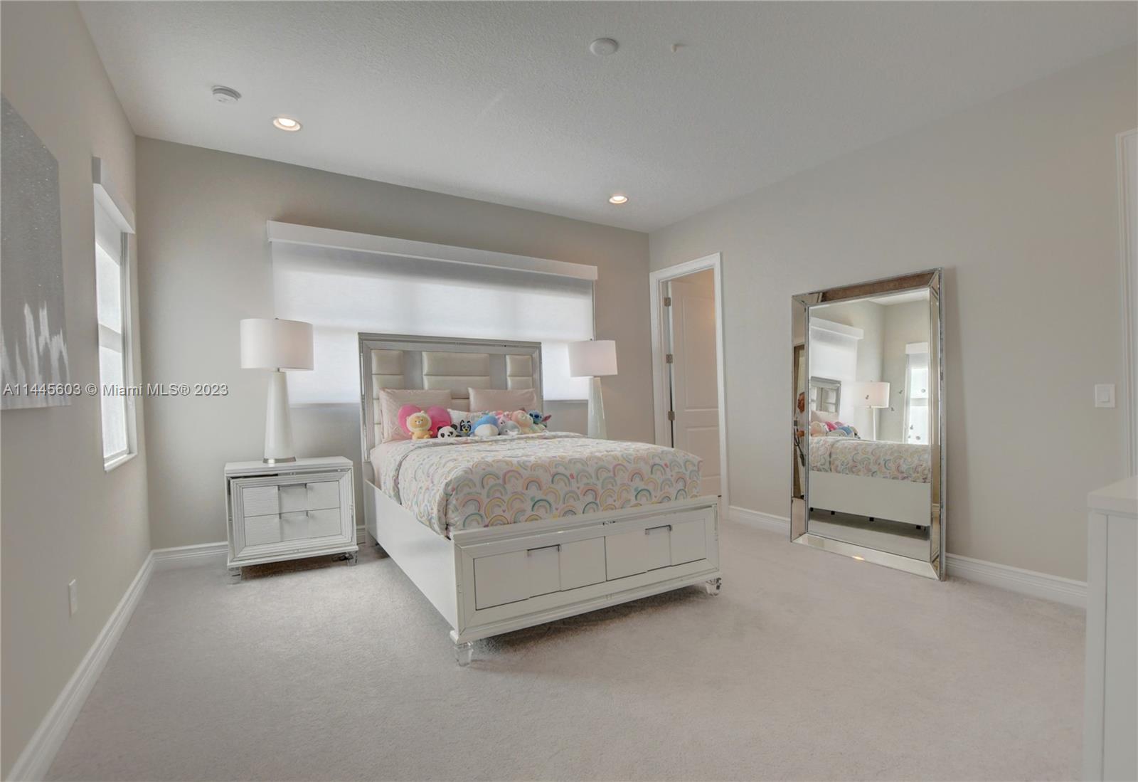 11655 Windy Frst Way Boca Raton, FL 33498 - Photo 37 of 69 a bedroom with a bed and a walk in closet