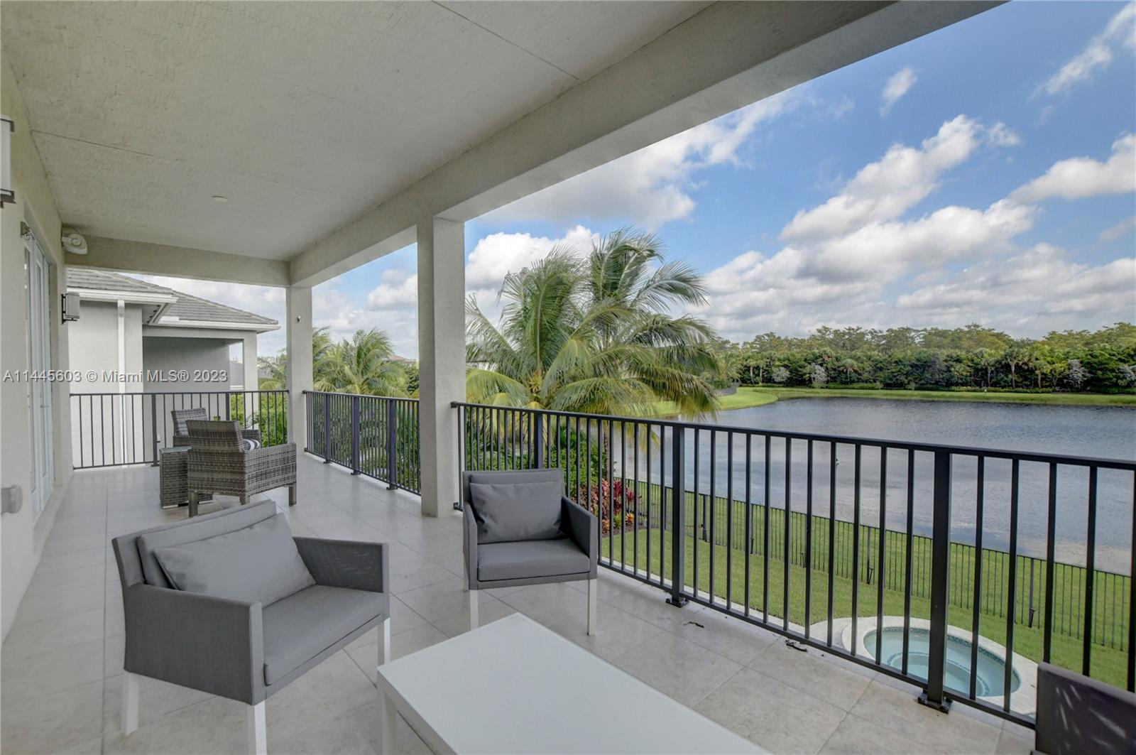 11655 Windy Frst Way Boca Raton, FL 33498 - Photo 50 of 69 a balcony with furniture and city view