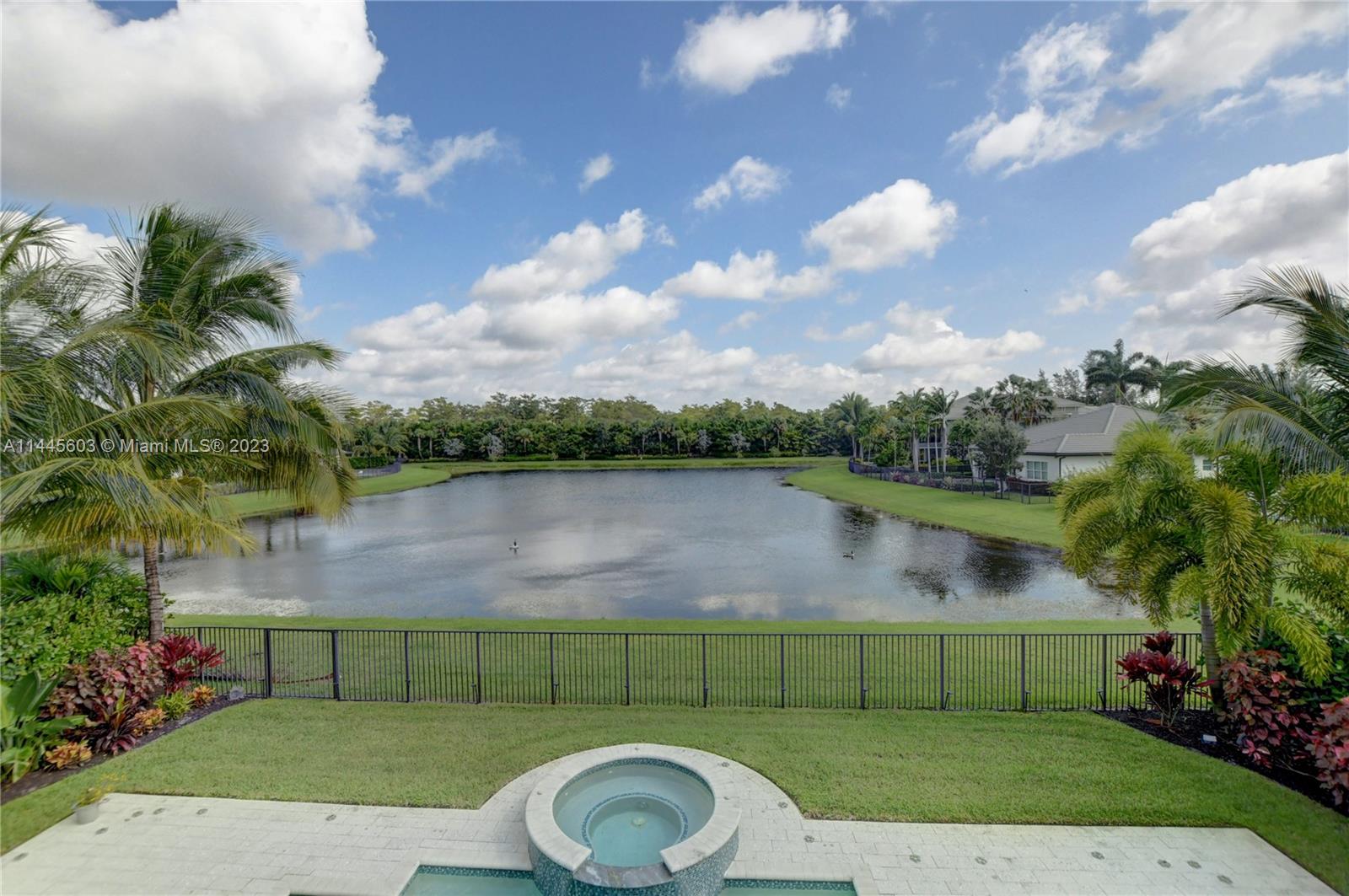 11655 Windy Frst Way Boca Raton, FL 33498 - Photo 51 of 69 a view of a lake from a yard