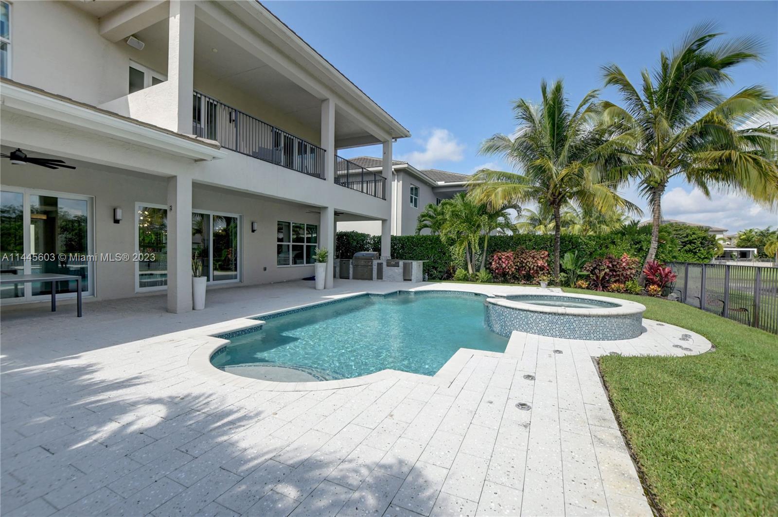 11655 Windy Frst Way Boca Raton, FL 33498 - Photo 57 of 69 a view of outdoor space yard deck patio and swimming pool