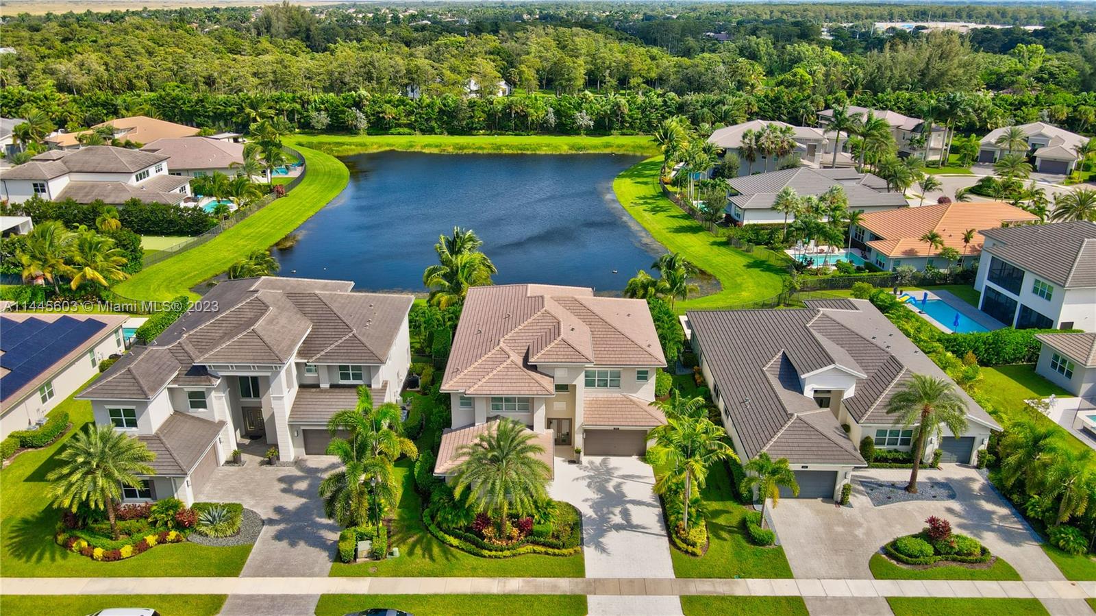 11655 Windy Frst Way Boca Raton, FL 33498 - Photo 68 of 69 an aerial view of multiple houses with a yard