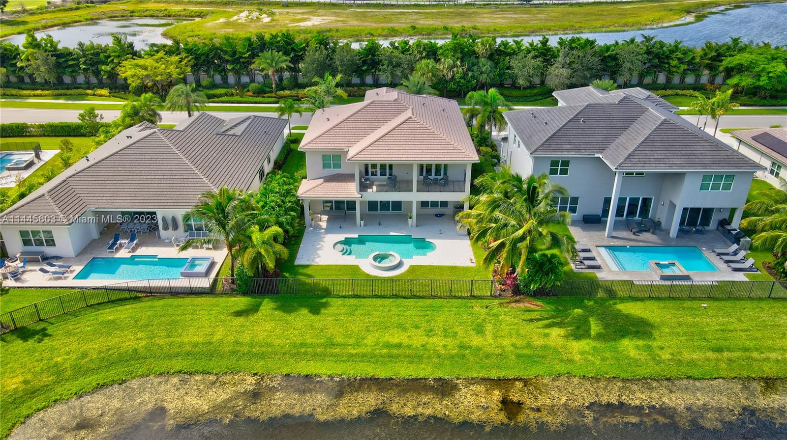 11655 Windy Frst Way Boca Raton, FL 33498 - Photo 7 of 69 a view of house with garden space and swimming pool