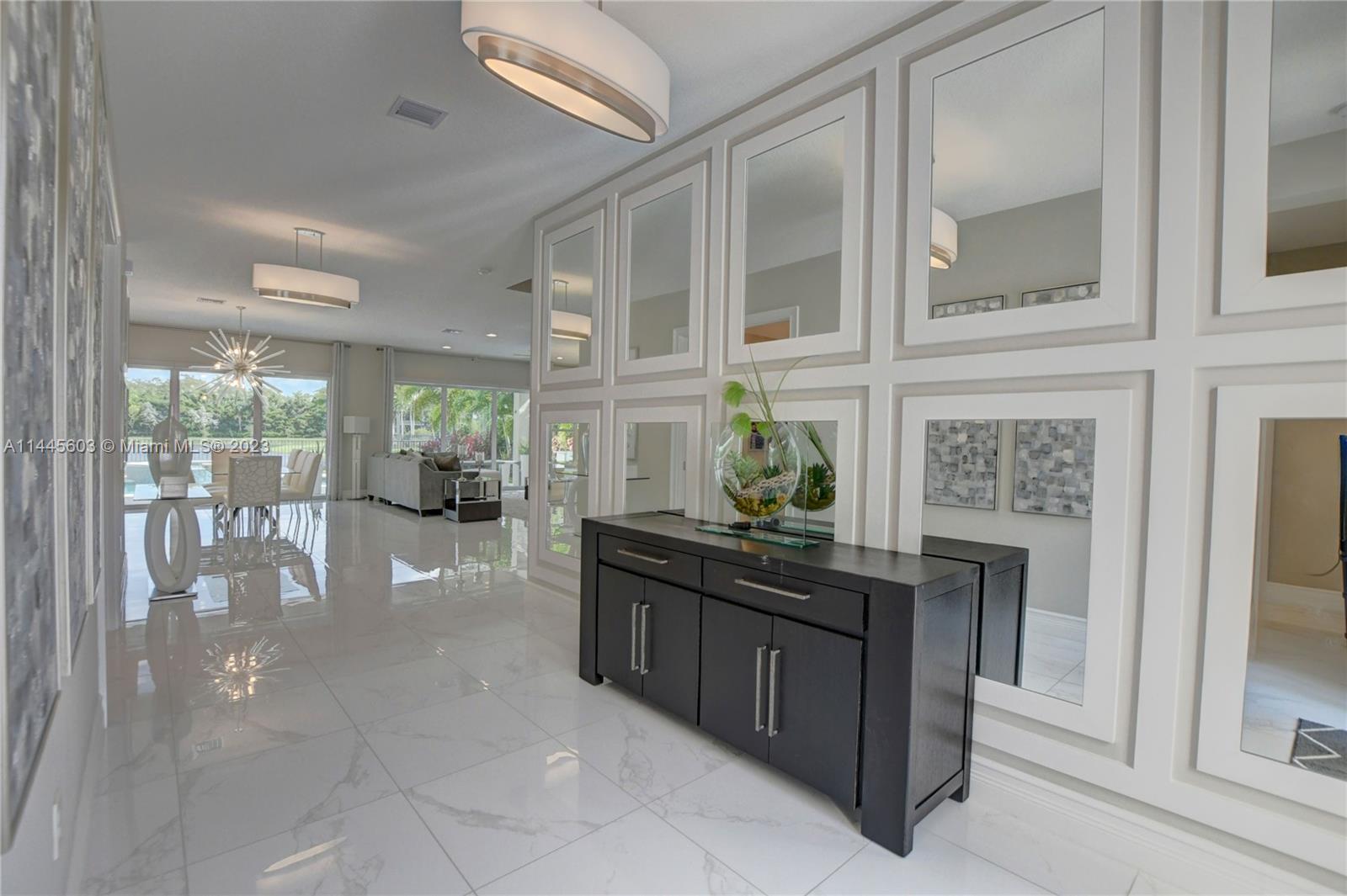 11655 Windy Frst Way Boca Raton, FL 33498 - Photo 9 of 69 a dining hall with stainless steel appliances granite countertop a stove and cabinets