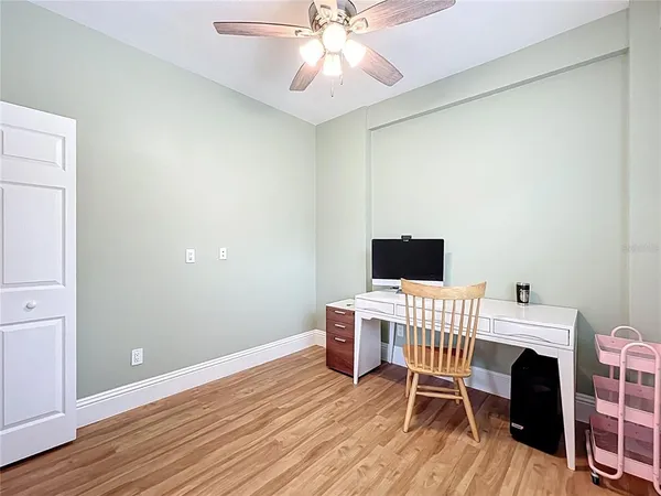 a workspace with furniture hardwood and a window