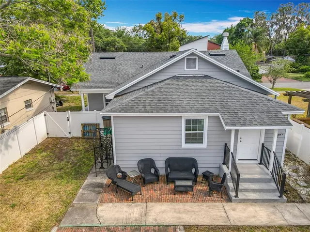 a front view of house with outdoor seating