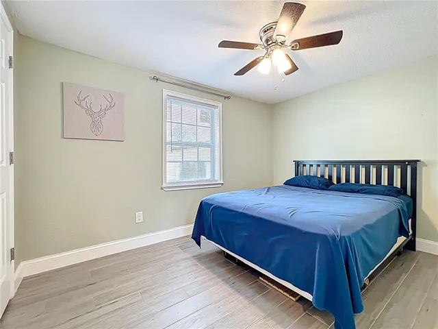a bedroom with a bed and window