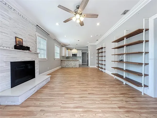 an empty room with a furniture and entryway