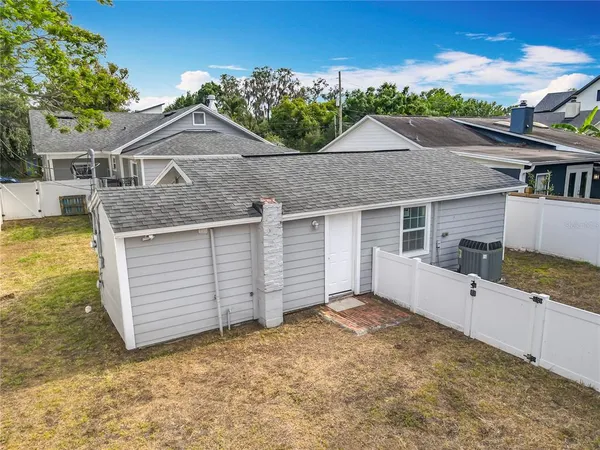 an aerial view of a house with a garden