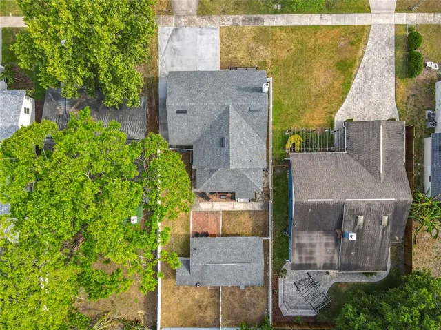 an aerial view of a house with a garden