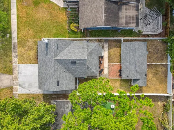 an aerial view of a house with a garden