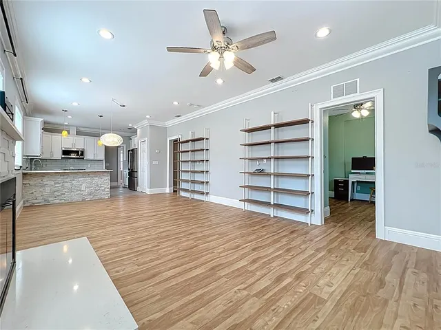 an empty room with a furniture and entryway