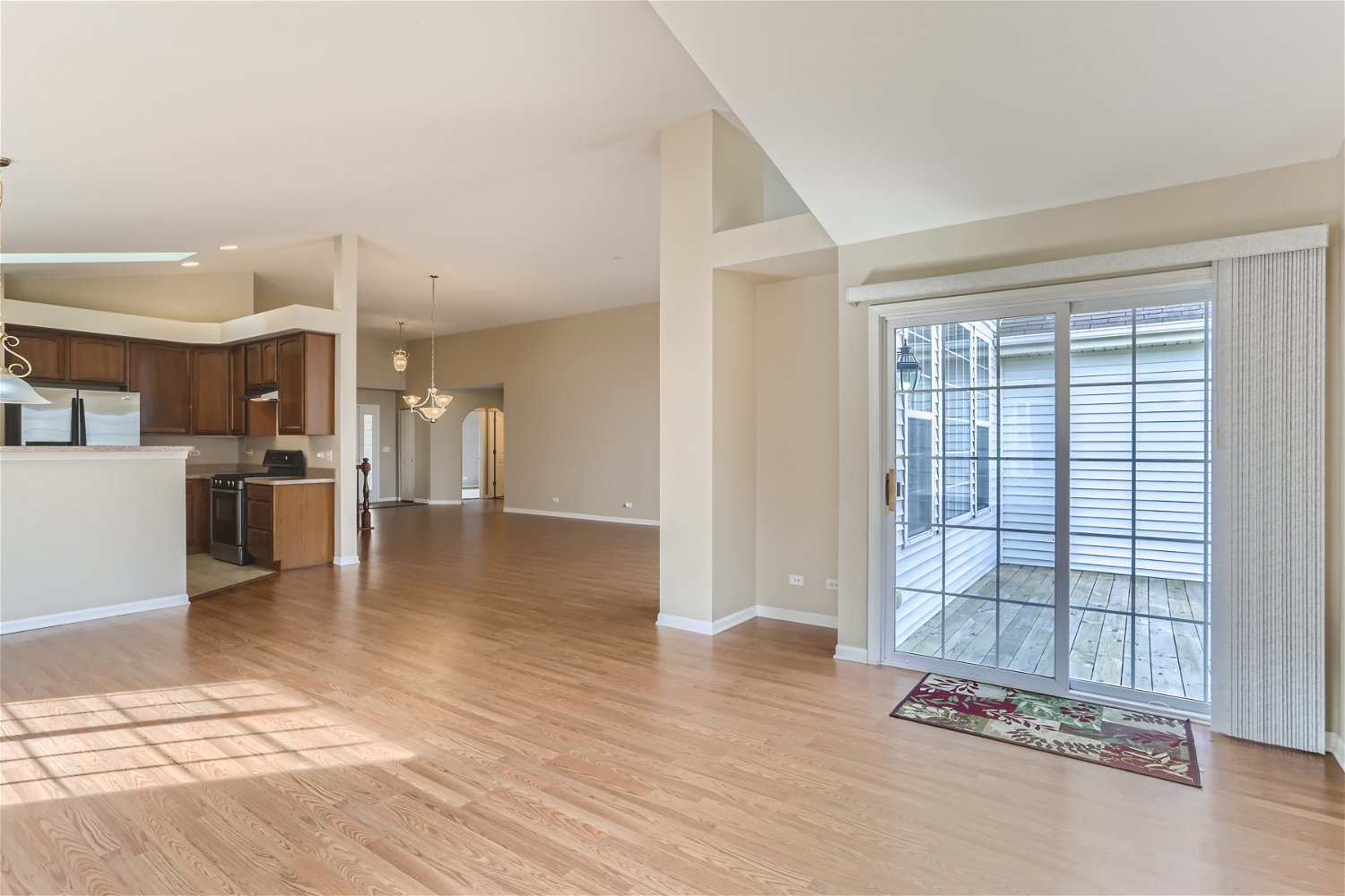 1840 Beachview Road Pingree Grove, IL 60140 - Photo 3 of 28 a view of a kitchen with furniture and a floor to ceiling window