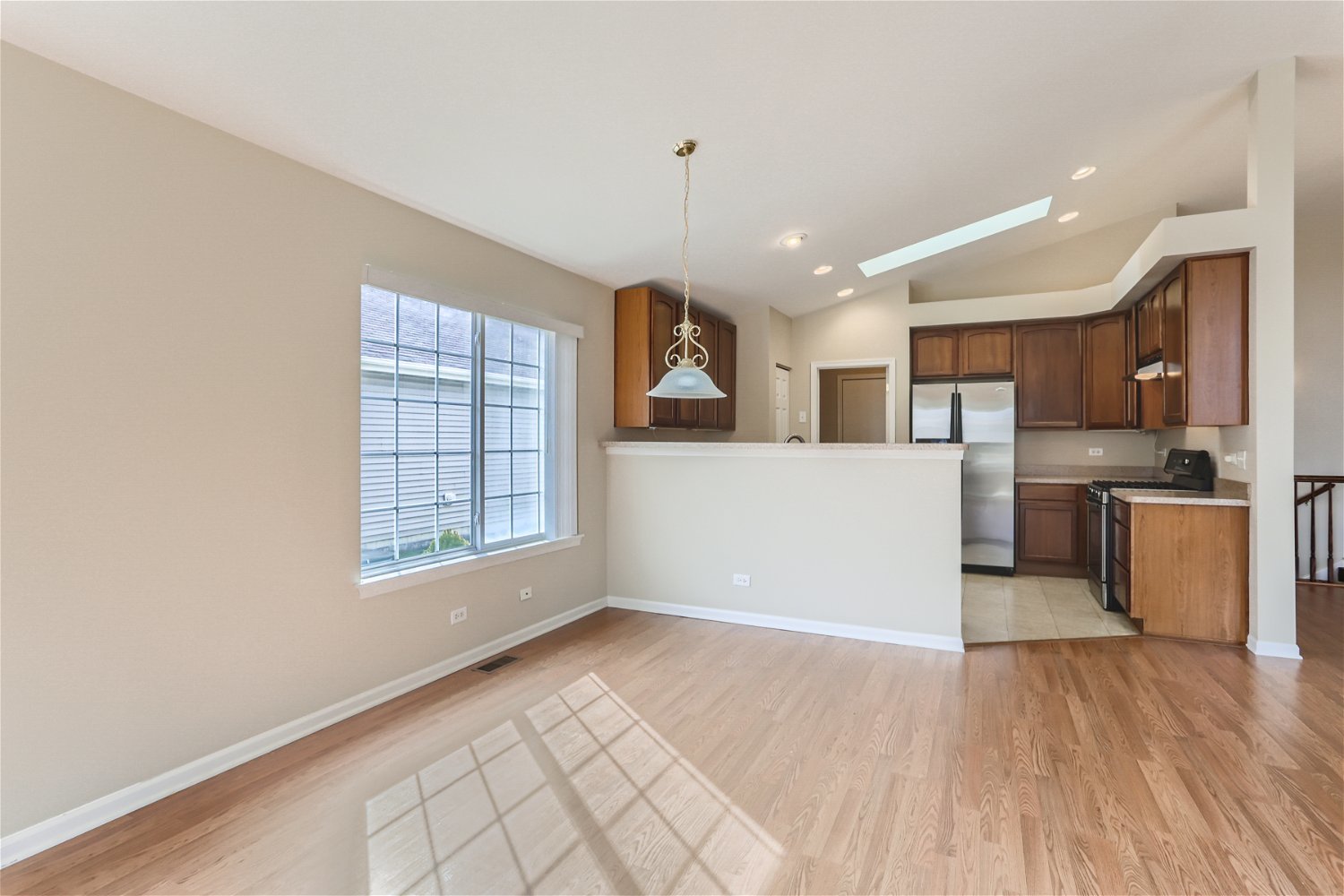 1840 Beachview Road Pingree Grove, IL 60140 - Photo 5 of 28 a view of a kitchen with furniture and wooden floor