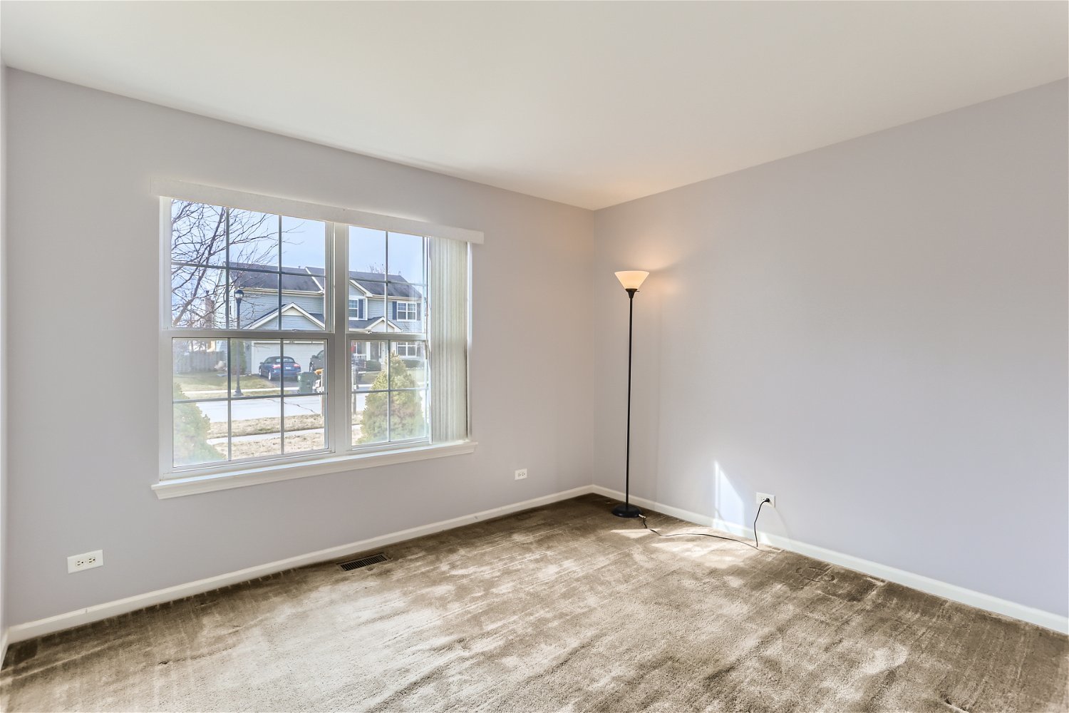 1840 Beachview Road Pingree Grove, IL 60140 - Photo 8 of 28 an empty room with a empty space and windows