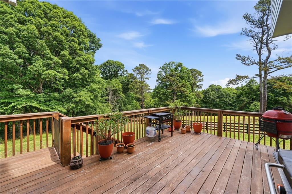 3535 Dr Bramblett Road Cumming, GA 30028 - Photo 62 of 91 a view of balcony with wooden floor and fence