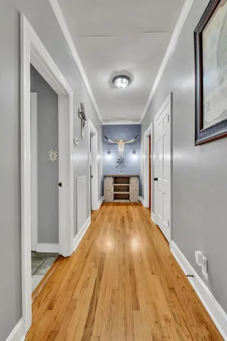 a view of a living room with wooden floor