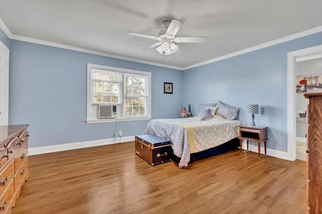 a spacious bedroom with a bed and a window