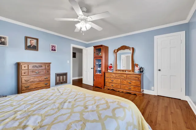 a bedroom with a bed and a dresser